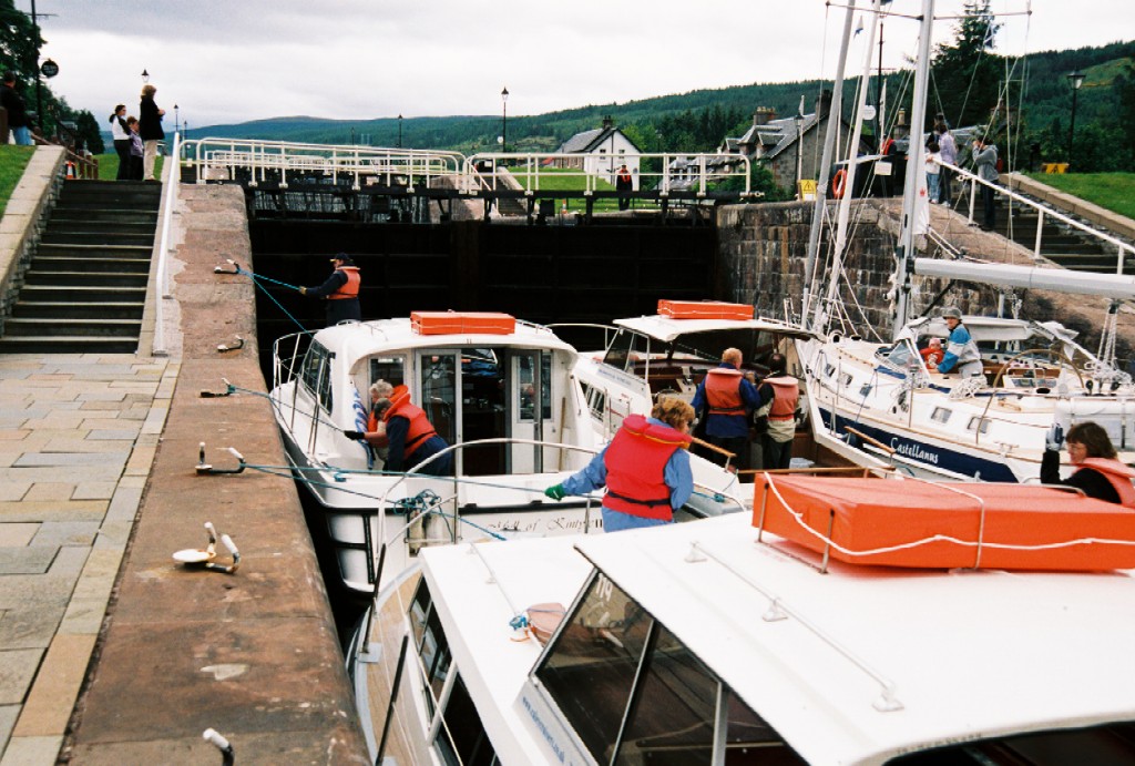 Boats in the locks of Fort Augustus, Scotland. The five steps of the locks allow passage between Loch Ness and the Caledonian Canal.