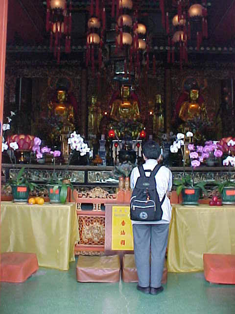 Prayers inside the Buddhist Shrine