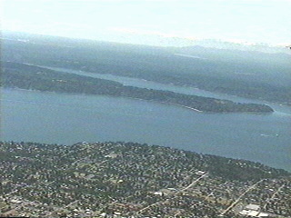 Flying over Puget Sound south from Seattle Washington