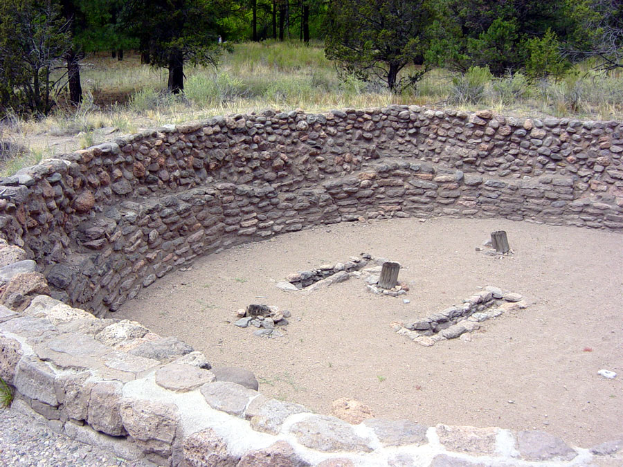 The Kiva was an underground pit covered by a roof of wood and earth. It was used primarily for religious activities. The entrance to it was an opening in the roof, and a ladder was used to get down. The small hole near the center of the floor is the
