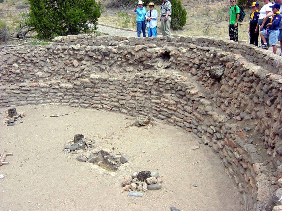 The hole in the wall might have been a ventilator shaft to draw fresh air in, while heat and smoke from the fire escaped through the ladder hole. The rectangular holes on the ground might have been used for foot drums.