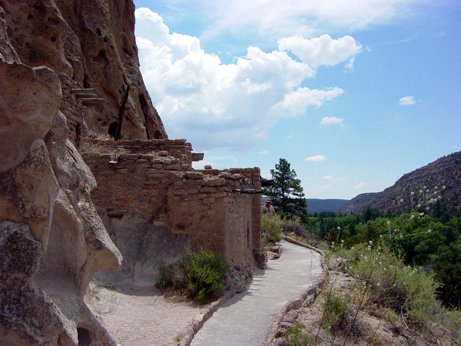 Side-view of the talus house. Note the wooden beams coming out of the cliff wall to support the roof.