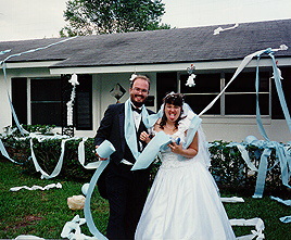 Bride and groom decorating mom's house after wedding