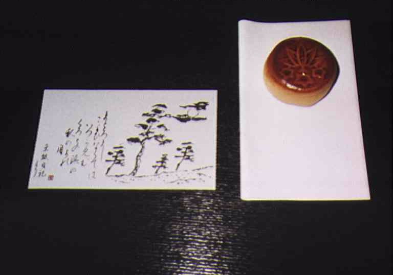 Bean paste sweet and calligraphy for tea ceremony