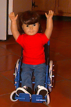 Sabrina the doll in her toy wheel chair.