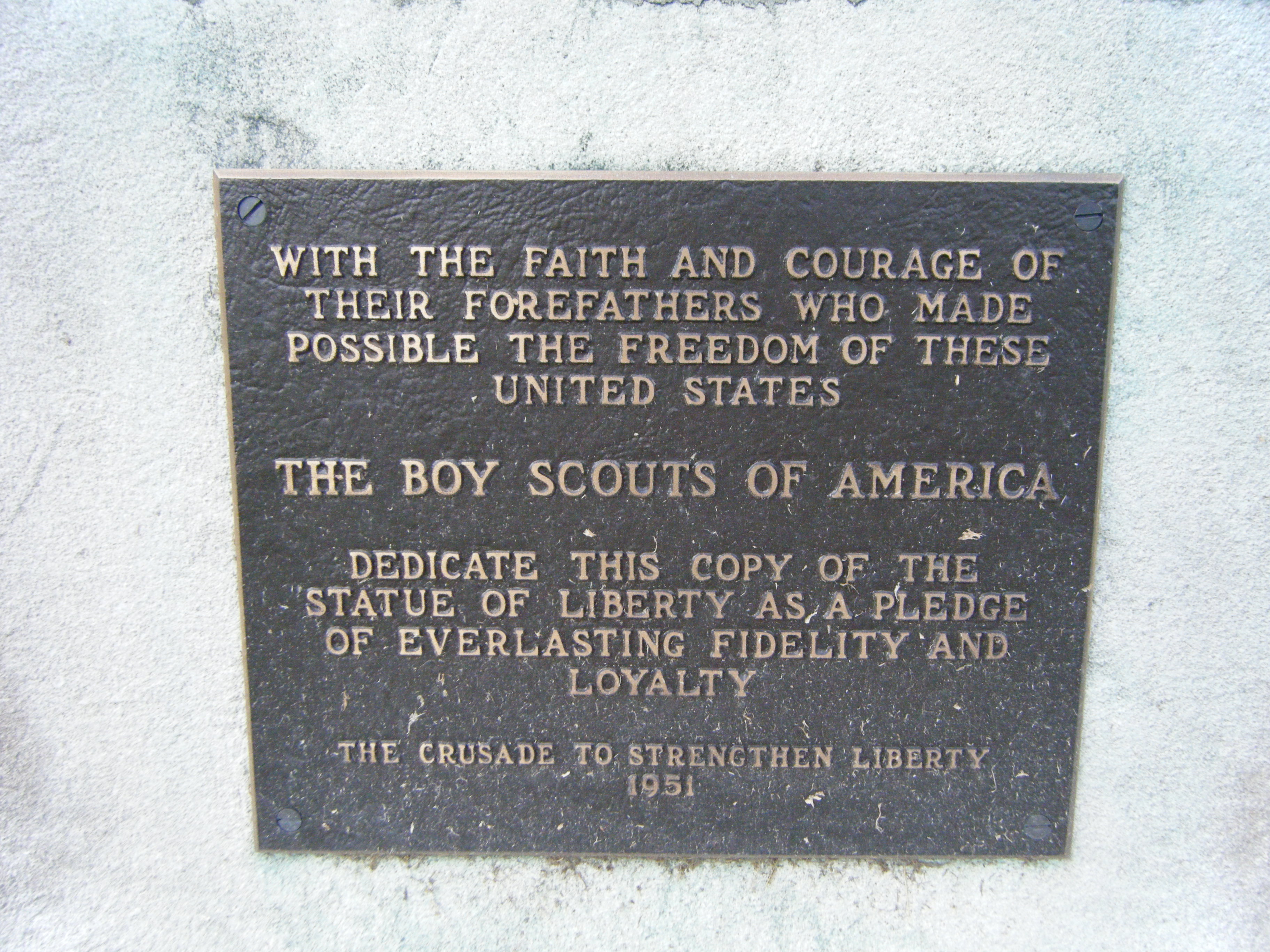 Copy of the Statue of Liberty contributed by the boy Scoutsin 1951 Memorial Plaque