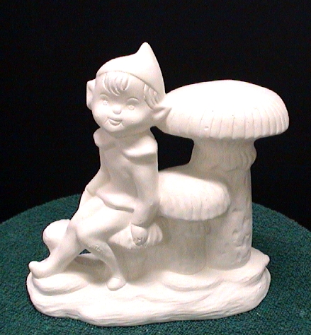 Ceramic elf sitting on a mushroom