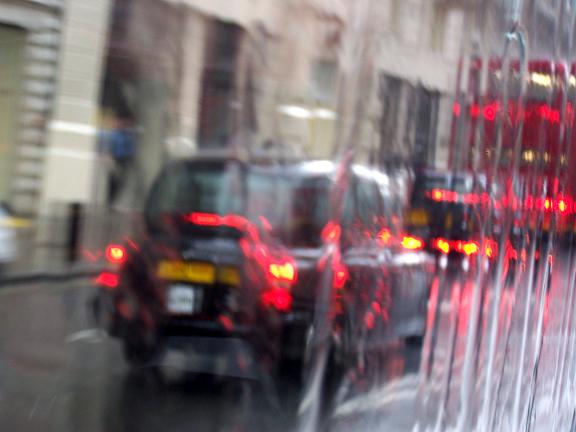 Taxi through a Rainy Window