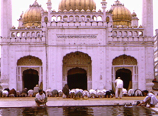 Men praying at mosque