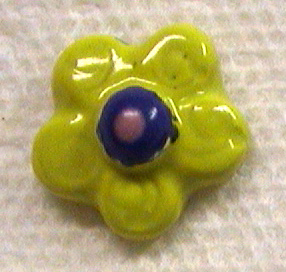 Ceramic flower about one inch in size