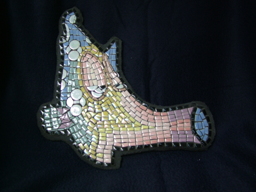 Mosaic flute fish made with tiny tile, circle tile and black grout.