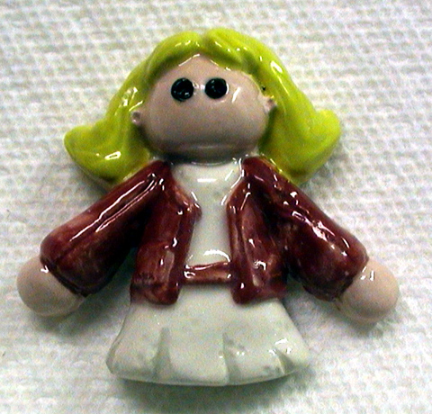 Ceramic tile girl about three inches tall
