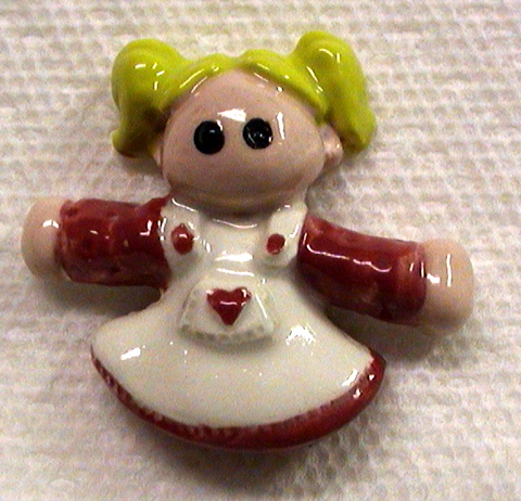 Ceramic tile girl about two and a half inches tall