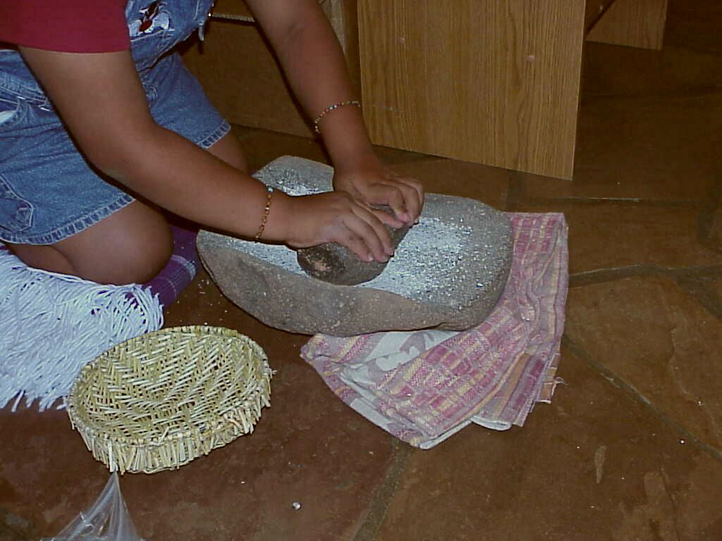 Hopi corn grinding