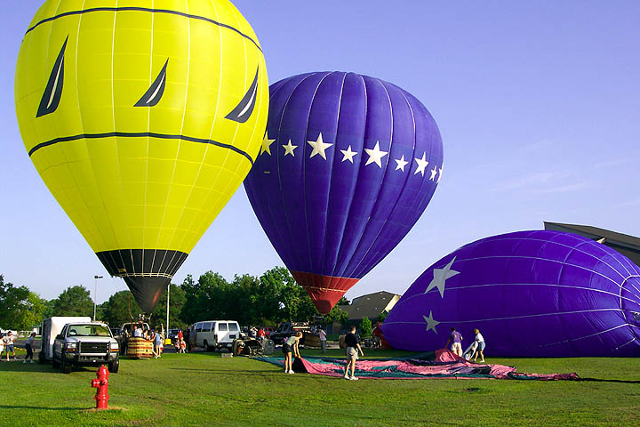 Several balloons in various stages for readiness for launching.