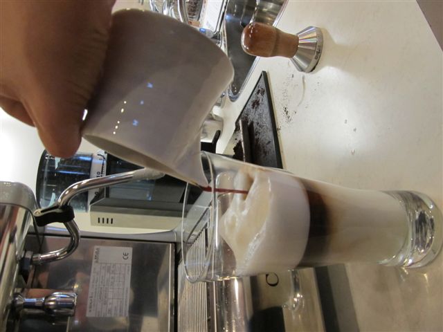 Pouring Espresso for a Layered Cafe Latte