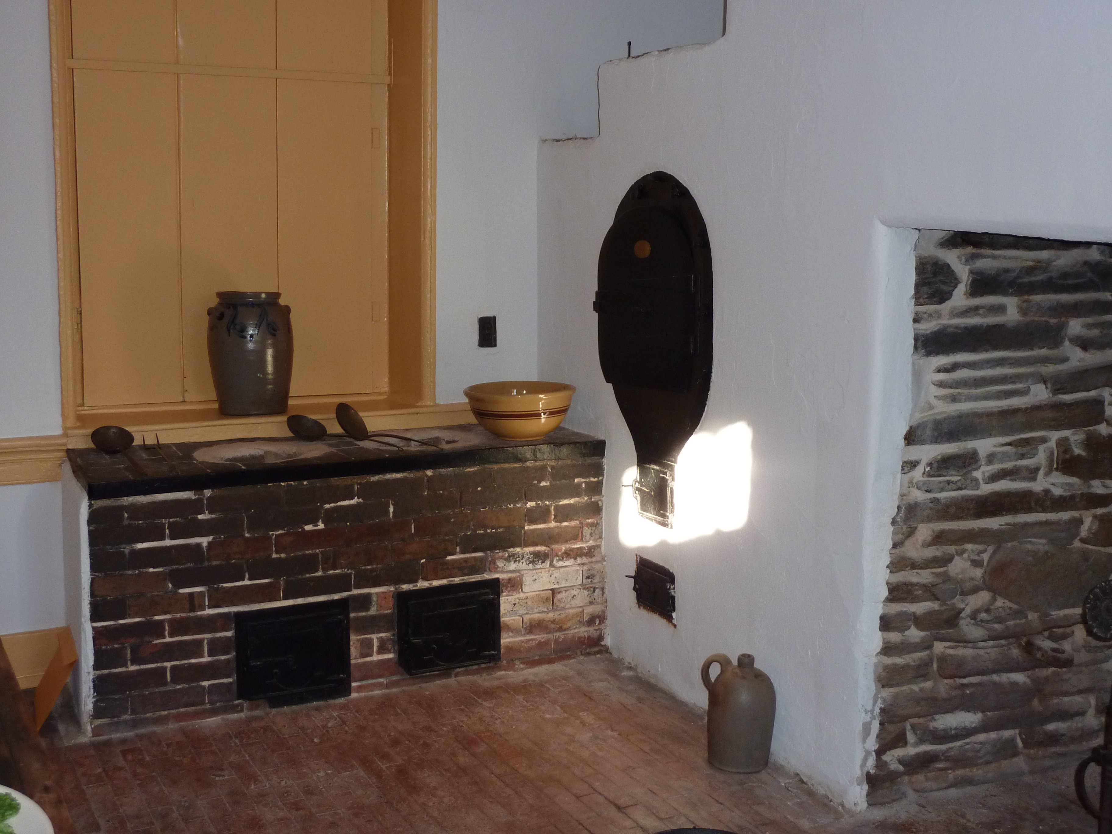 The kitchen in the mansion showing bake oven and simmer pots.