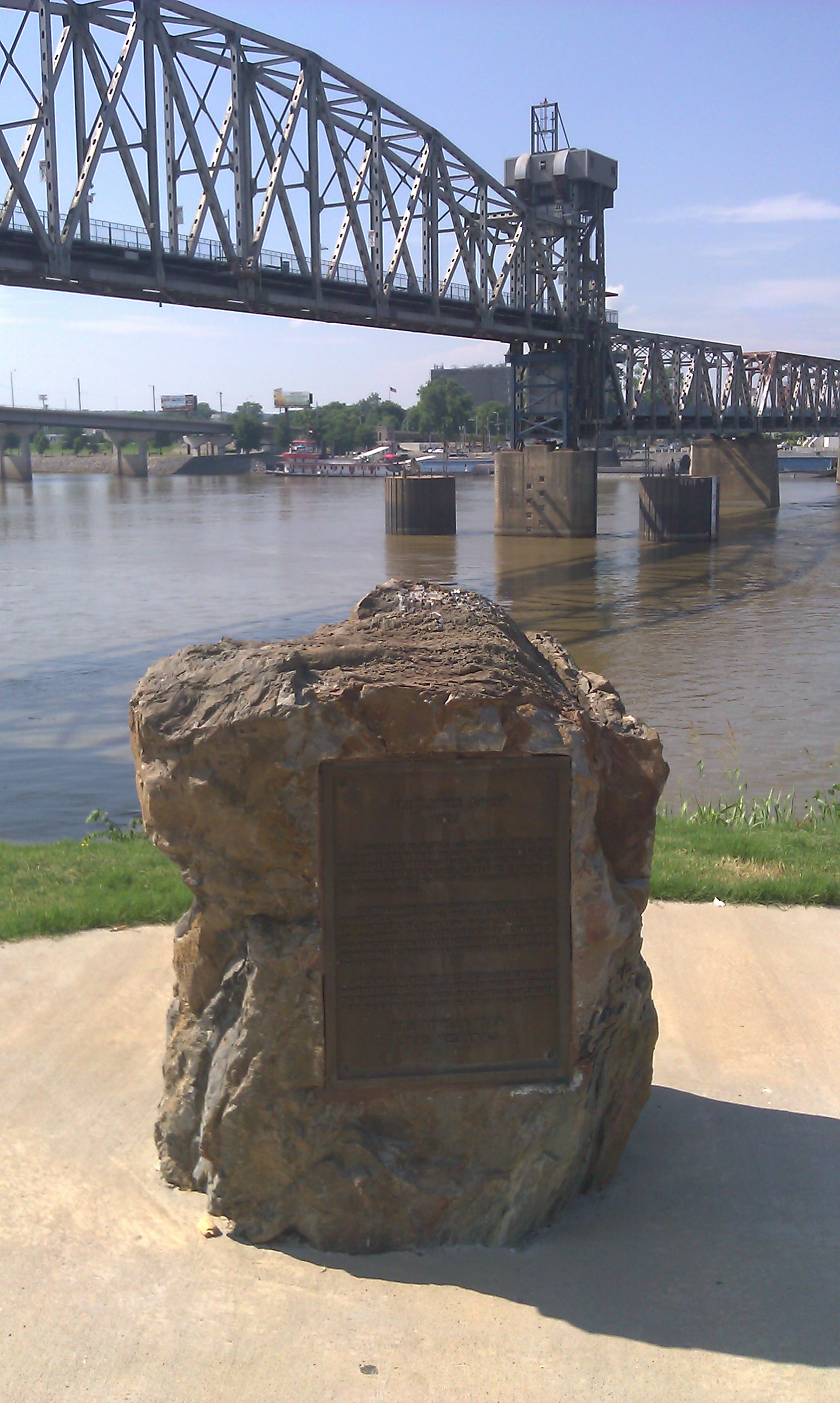 La Petite Roche - the first rock visible on the Arkansas when navigated from the Mississippi - Small fragment of larger rock demolished during construction of bridge in background