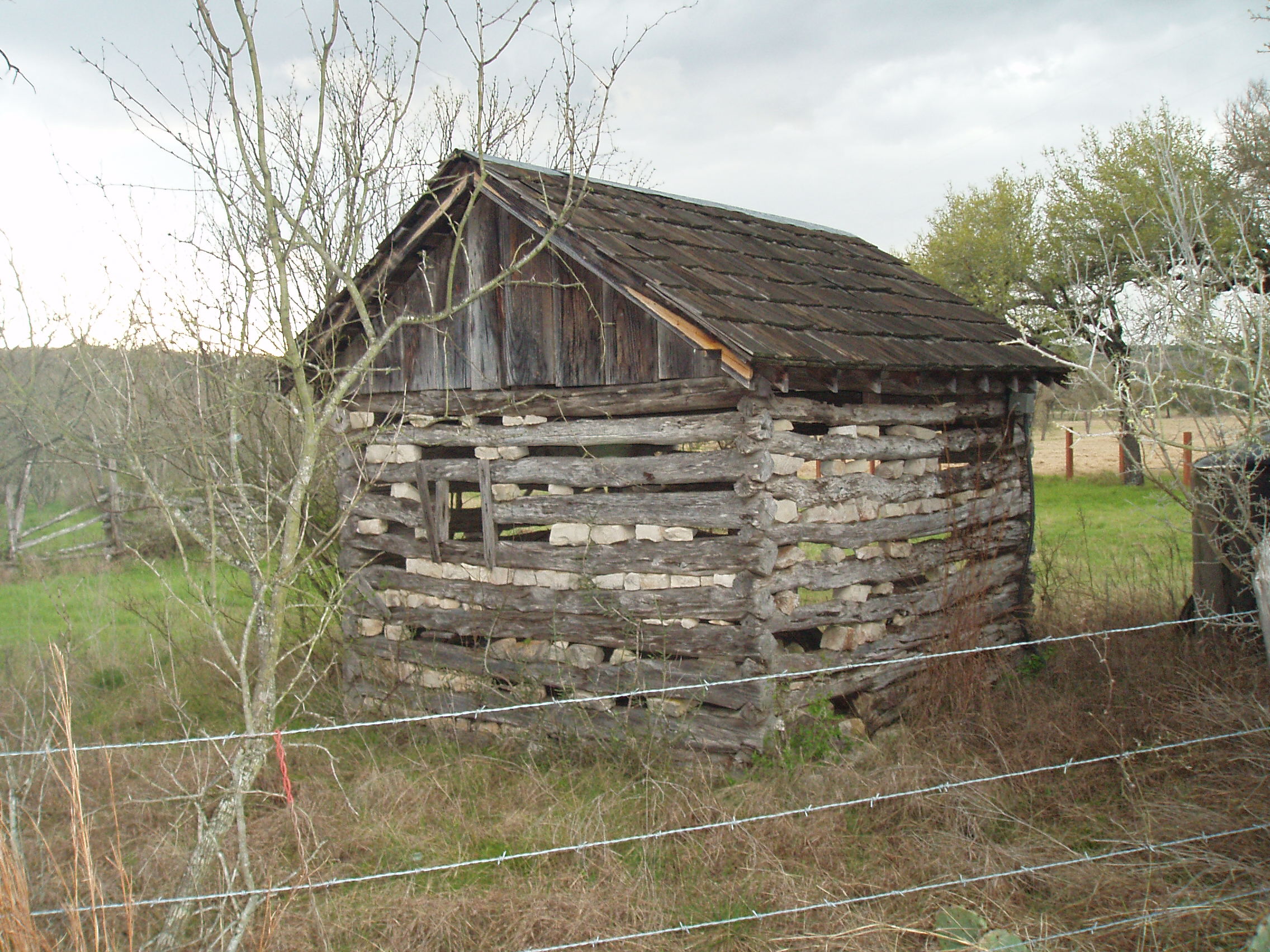 Old log structure chinked with rocks