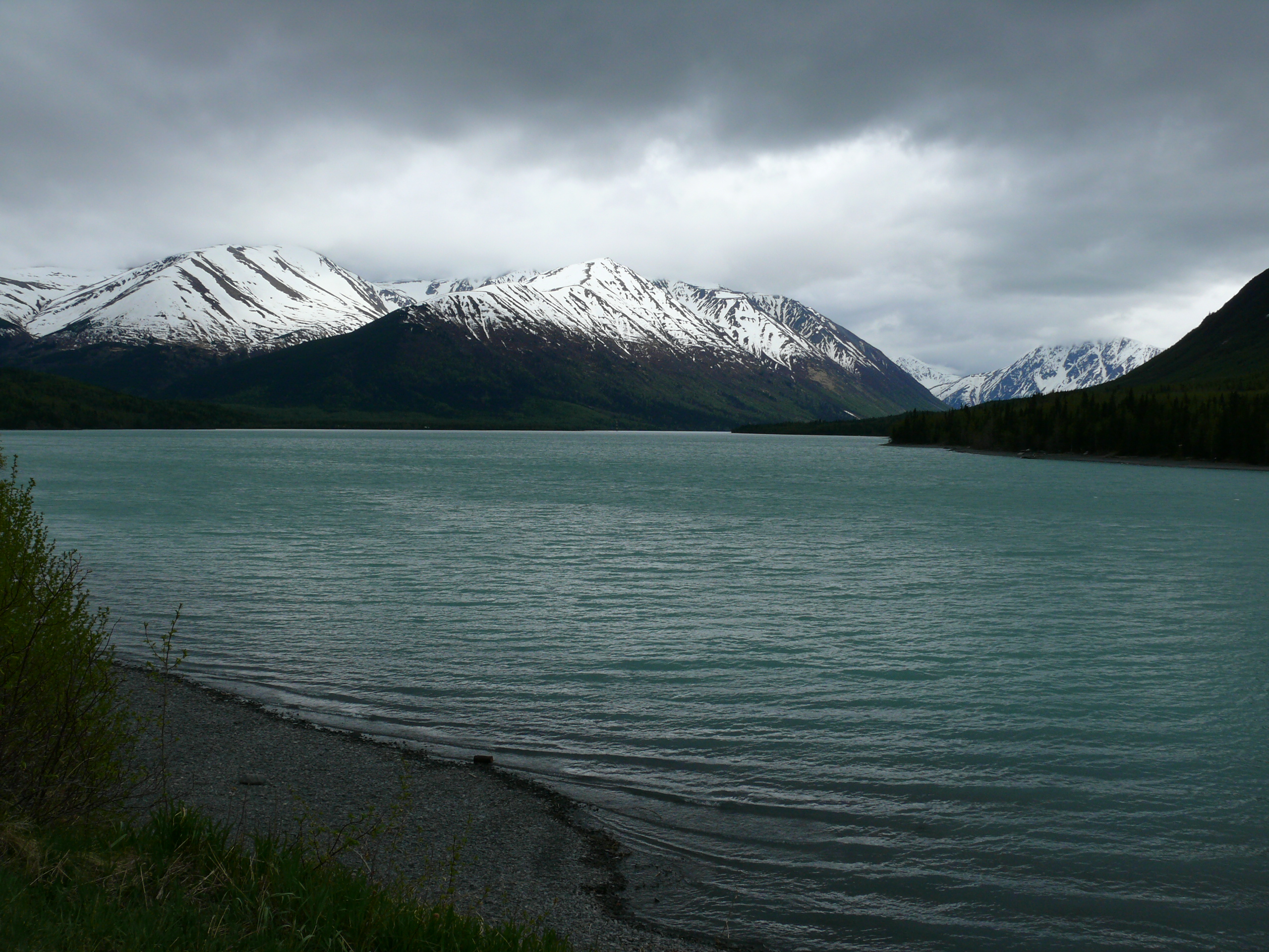 Clouds, mountians and a lake make for a wonderful scene in Alaska