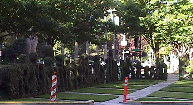 Topiary fence of little people