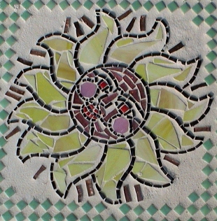 Mosaic sun stepping stone created with stained glass and tiny tile