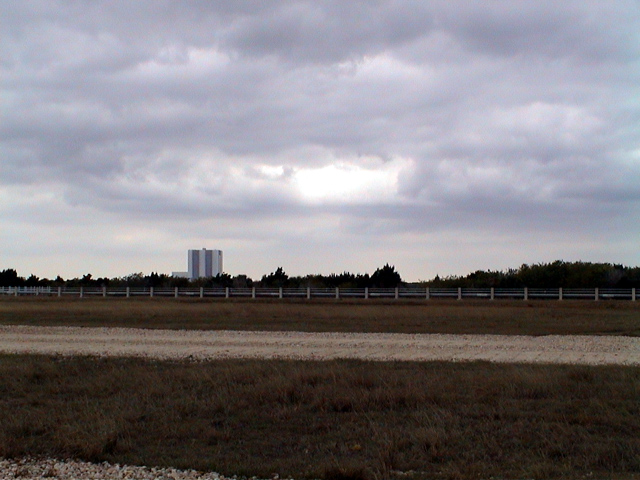 Vertical Assembly Building sighted from Space Shuttle Launch Pad B. The VAB building is approximately three miles away.