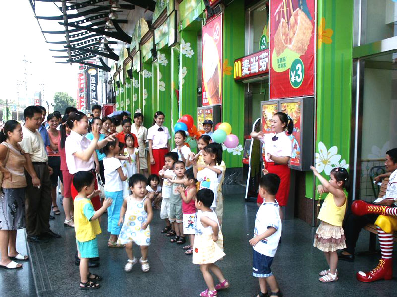 A birthday party outside of Mcdonalds.