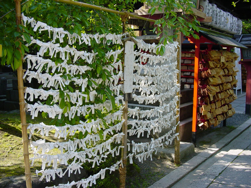 Fortunes tied to string and wishes written on plaques | Pics4Learning