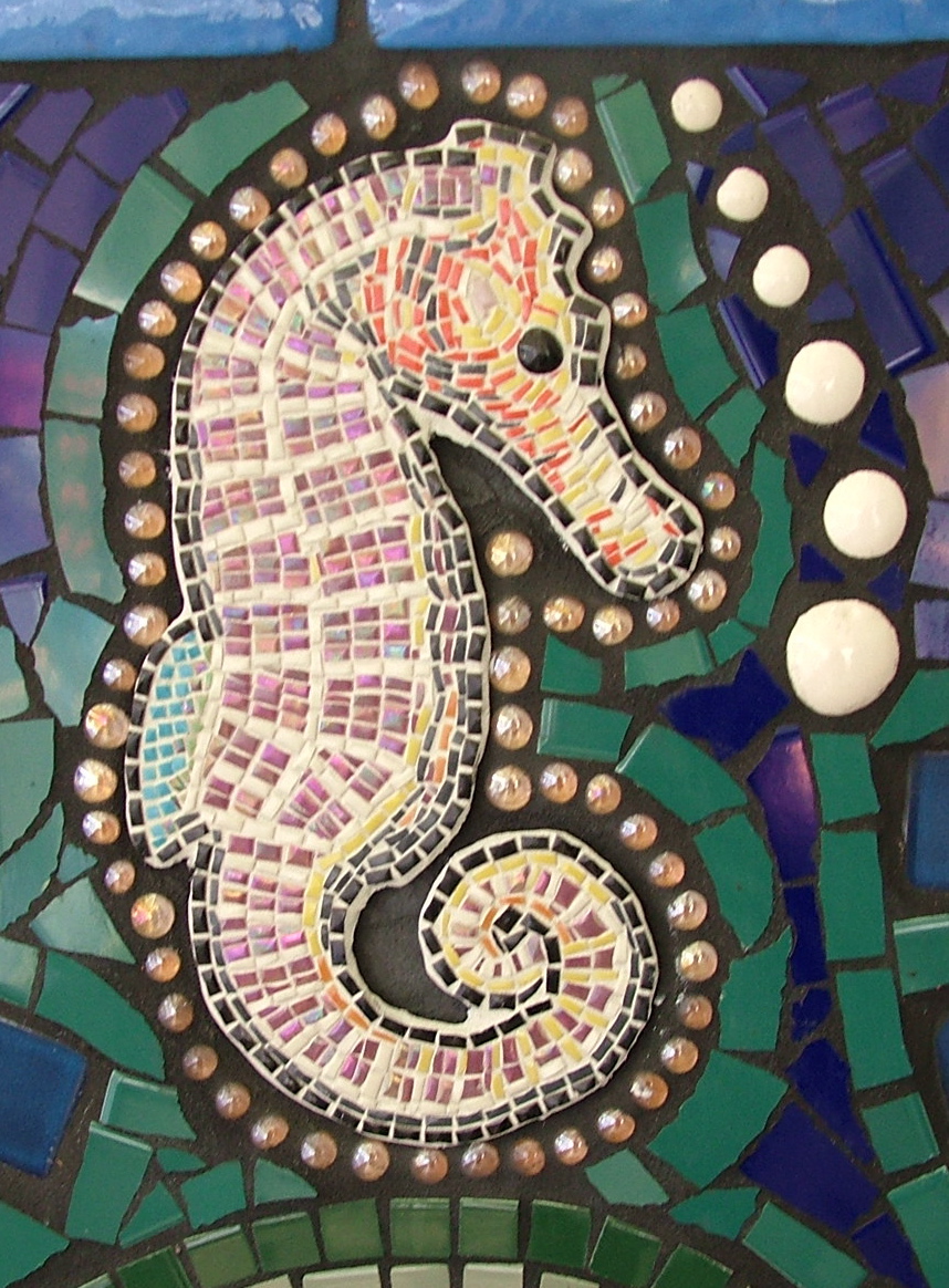 Mosaic seahorse created with ceramic tiny tile mounted on a mosaic wall