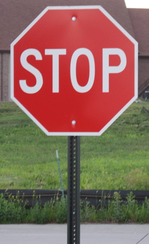 Stop sign on corner | Pics4Learning